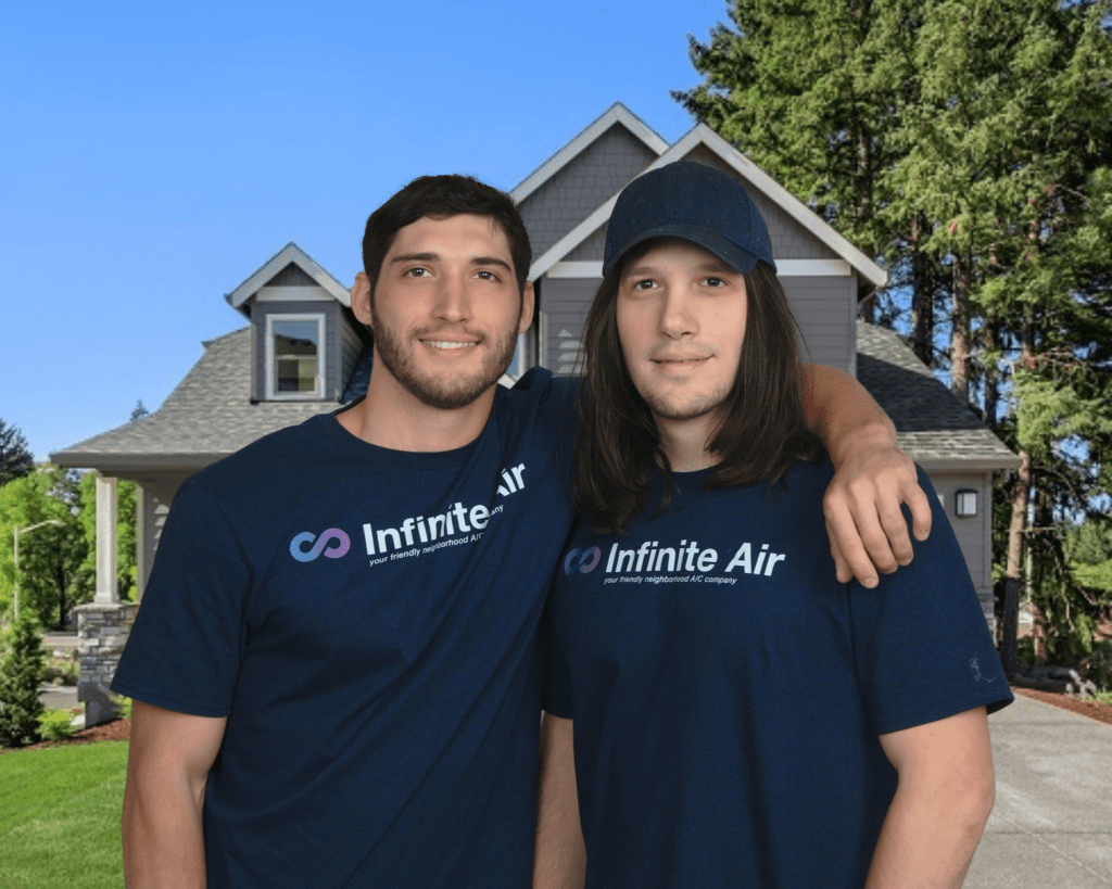 Image of two HVAC techs with infinite air shirts in front of a home